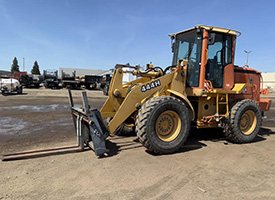 John Deere 444H Wheel Loader for sale in Sacramento, California. 4x4 diesel, powershift transmission, EROPS cab with AC and heat, 60" forks, 61" frame, hydraulic quick coupler, auxiliary hydraulics, pneumatic tires. 4,568 hours, serial number DW444HX574422